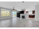 Open living area with marble fireplace, backyard access, ceiling fan, and direct access to the kitchen at 3079 Evening Mist Ave, Henderson, NV 89052
