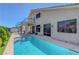 Enjoy the backyard with a refreshing swimming pool, complemented by a charming two-story home at 3079 Evening Mist Ave, Henderson, NV 89052