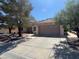 Single-story home with a wide driveway, desert landscaping, and an attached garage in a sunny neighborhood at 3104 Birch Grove Ct, Las Vegas, NV 89134
