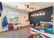 Bright bedroom with a large window, plush carpet, and playful decor at 3309 Green Ice Ave, North Las Vegas, NV 89081