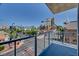 A balcony overlooking downtown with palm trees and views of buildings at 353 E Bonneville Ave # 313, Las Vegas, NV 89101