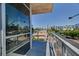 A balcony with street views of palm trees and commercial buildings in the city at 353 E Bonneville Ave # 313, Las Vegas, NV 89101