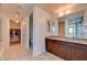 Bright bathroom featuring a double sink vanity, walk in closet, and a toilet area at 353 E Bonneville Ave # 313, Las Vegas, NV 89101