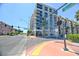 An exterior street view of a modern condo building with a mixed-use commercial space is shown at 353 E Bonneville Ave # 313, Las Vegas, NV 89101