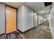 Condo hallway with carpet, neutral walls, and recessed lighting provides a clean and accessible path to individual units at 353 E Bonneville Ave # 313, Las Vegas, NV 89101