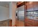 Modern kitchen featuring stainless steel appliances, granite countertops, and sleek wood cabinetry at 353 E Bonneville Ave # 313, Las Vegas, NV 89101