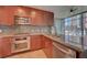 Modern kitchen featuring stainless steel appliances and granite countertops with a large window view at 353 E Bonneville Ave # 313, Las Vegas, NV 89101