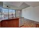 Modern kitchen featuring stainless steel appliances, granite countertops, and a large window view at 353 E Bonneville Ave # 313, Las Vegas, NV 89101