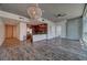 Open-concept condo features hardwood floors, concrete walls, modern lighting, and stainless steel appliances for upscale living at 353 E Bonneville Ave # 313, Las Vegas, NV 89101