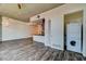 Open concept living room and kitchen with hardwood floors, granite countertops, and washer/dryer at 353 E Bonneville Ave # 313, Las Vegas, NV 89101