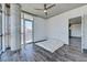 Bright and airy main bedroom with hardwood floors and concrete pillar at 353 E Bonneville Ave # 313, Las Vegas, NV 89101