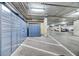 Bright parking garage features convenient storage lockers and clean, well-marked parking spaces at 353 E Bonneville Ave # 313, Las Vegas, NV 89101