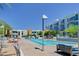Resort-style pool with lounge chairs and lush landscaping, ideal for relaxation and recreation at 353 E Bonneville Ave # 313, Las Vegas, NV 89101