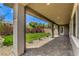 Covered patio overlooking a spacious, lush green backyard, perfect for outdoor living and entertaining at 365 Sapphire Rock Ave, Las Vegas, NV 89183