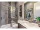 Stylish bathroom featuring a glass-enclosed shower, modern vanity, and elegant gray tile accents at 365 Sapphire Rock Ave, Las Vegas, NV 89183