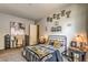 Inviting bedroom featuring hockey-themed decor, a comfortable bed, and a functional study area at 365 Sapphire Rock Ave, Las Vegas, NV 89183