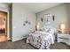 Well-lit bedroom with a stylish bed set, bedside tables and decorative art pieces at 365 Sapphire Rock Ave, Las Vegas, NV 89183