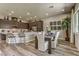 Dining room area featuring wood floor, modern appliances, stylish light fixtures and comfortable seating at 365 Sapphire Rock Ave, Las Vegas, NV 89183