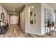 Inviting foyer with wood-look floors, decorative niche, console table, and stylish accents at 365 Sapphire Rock Ave, Las Vegas, NV 89183