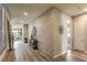Stylish hallway featuring a decorative brick wall, wood-look floors, and modern decor at 365 Sapphire Rock Ave, Las Vegas, NV 89183