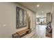 Elegant hallway with wood-look floors, modern decor, and access to the bright living spaces at 365 Sapphire Rock Ave, Las Vegas, NV 89183