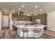 A modern kitchen with stainless appliances, decorative tile backsplash, large island, and stylish seating at 365 Sapphire Rock Ave, Las Vegas, NV 89183