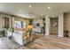 Bright living room with stylish furnishings, wood-look floors, and contemporary design elements at 365 Sapphire Rock Ave, Las Vegas, NV 89183