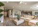 Expansive living space featuring open layout, stylish decor, and seamless flow to the kitchen and dining areas at 365 Sapphire Rock Ave, Las Vegas, NV 89183