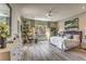 Spacious main bedroom with a ceiling fan, large windows providing natural light and a decorative dresser at 365 Sapphire Rock Ave, Las Vegas, NV 89183