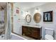 Bathroom with double sink vanity, decorative mirrors, and a shower-tub combination at 3712 Royal Crest St # 14, Las Vegas, NV 89119