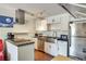Modern kitchen features stainless steel appliances, a large stainless steel sink, and stylish track lighting at 3712 Royal Crest St # 14, Las Vegas, NV 89119
