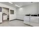 Clean laundry room equipped with multiple washing machines and dryers at 3712 Royal Crest St # 14, Las Vegas, NV 89119
