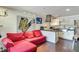 Open-concept living space showcasing a contemporary kitchen and comfortable seating area with hardwood floors at 3712 Royal Crest St # 14, Las Vegas, NV 89119