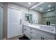 Beautiful bathroom with modern double sink vanity, matte black hardware, and large mirror at 4083 Nook Way # A, Las Vegas, NV 89103