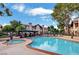 Large community pool and jacuzzi with plenty of lounge seating, mature trees, and lush landscaping at 4083 Nook Way # A, Las Vegas, NV 89103