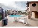 Community pool area with lounge seating, dining area, and well-maintained landscaping at 4083 Nook Way # A, Las Vegas, NV 89103