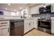 Kitchen features stainless steel appliances, white cabinets, and modern design at 4083 Nook Way # A, Las Vegas, NV 89103