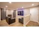 Inviting living room featuring a fireplace, flat-screen television, hardwood flooring, and comfortable seating at 4083 Nook Way # A, Las Vegas, NV 89103