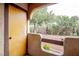 Enclosed patio with unique arch details, shade trees, and rock landscape at 4083 Nook Way # A, Las Vegas, NV 89103