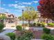Community pool and landscaping with manicured shrubs and trees at this condo complex in Nevada at 4083 Nook Way # A, Las Vegas, NV 89103