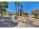 Expansive backyard with desert landscaping and a clear view of the house at 4542 Amber Canyon Ln, Las Vegas, NV 89129