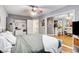 Bright bedroom features hardwood floors, ceiling fan, and a view into the next room at 4542 Amber Canyon Ln, Las Vegas, NV 89129