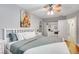 Bright bedroom featuring hardwood floors, ceiling fan, and a walk-in closet at 4542 Amber Canyon Ln, Las Vegas, NV 89129