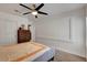 Bright bedroom features a ceiling fan, wall trim, neutral carpet and a large sliding door closet at 4542 Amber Canyon Ln, Las Vegas, NV 89129