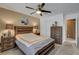 Cozy bedroom with a ceiling fan, carpet flooring, neutral walls, and a large closet at 4542 Amber Canyon Ln, Las Vegas, NV 89129