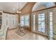 Cozy breakfast area with seating for two and natural lighting plus outdoor patio and pool views at 4542 Amber Canyon Ln, Las Vegas, NV 89129