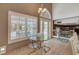 Breakfast nook with modern seating, natural lighting, and views of the outside patio and pool at 4542 Amber Canyon Ln, Las Vegas, NV 89129
