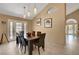 Elegant dining area featuring tile flooring and modern lighting fixtures at 4542 Amber Canyon Ln, Las Vegas, NV 89129
