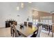 Beautiful dining room with table and chairs, pendant lighting, and view of living area at 4542 Amber Canyon Ln, Las Vegas, NV 89129