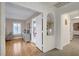 Inviting hallway leads to carpet and wood flooring, with neutral walls and custom architectural niche at 4542 Amber Canyon Ln, Las Vegas, NV 89129